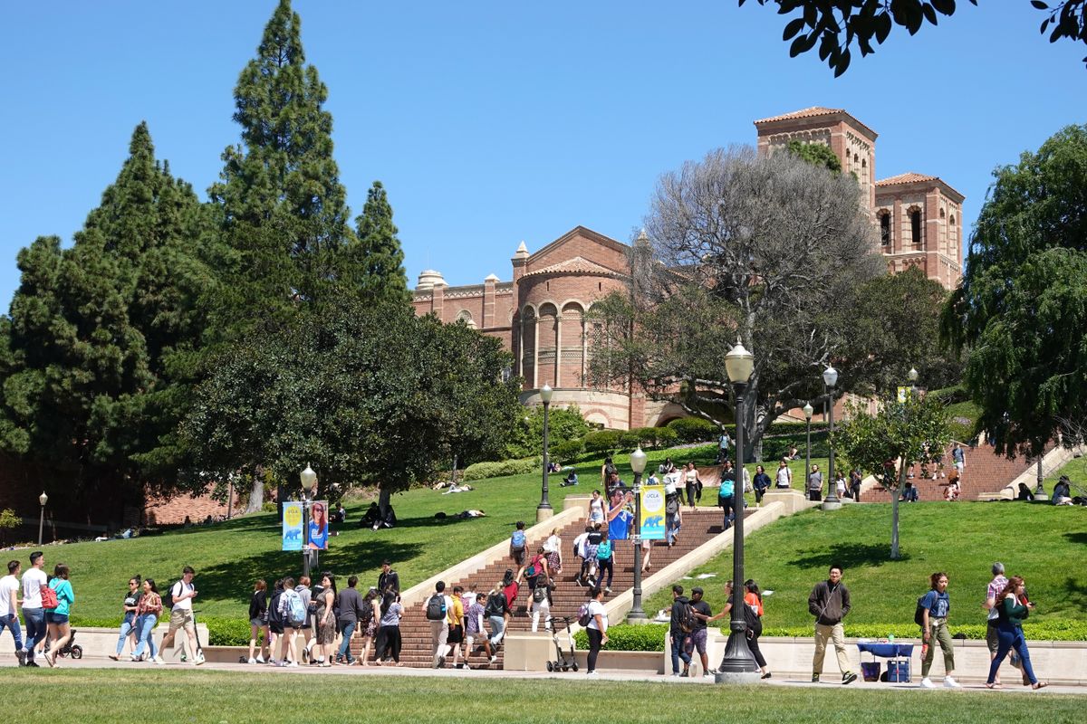 Students on the UCLA campus, with the Janss Steps and Royce Hall in the bac...
